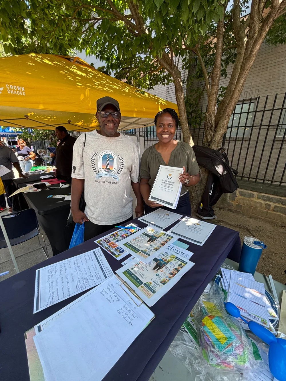 Sherma Apparicio-D’Afflitto sharing the Daily Health and Care Log at a community health fair